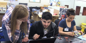students at computer and making robot