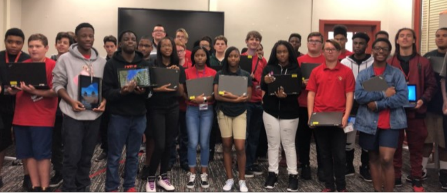 Computer Science students at Andrew Jackson High School receive computers through our Closing the Digital Divide initiative. 