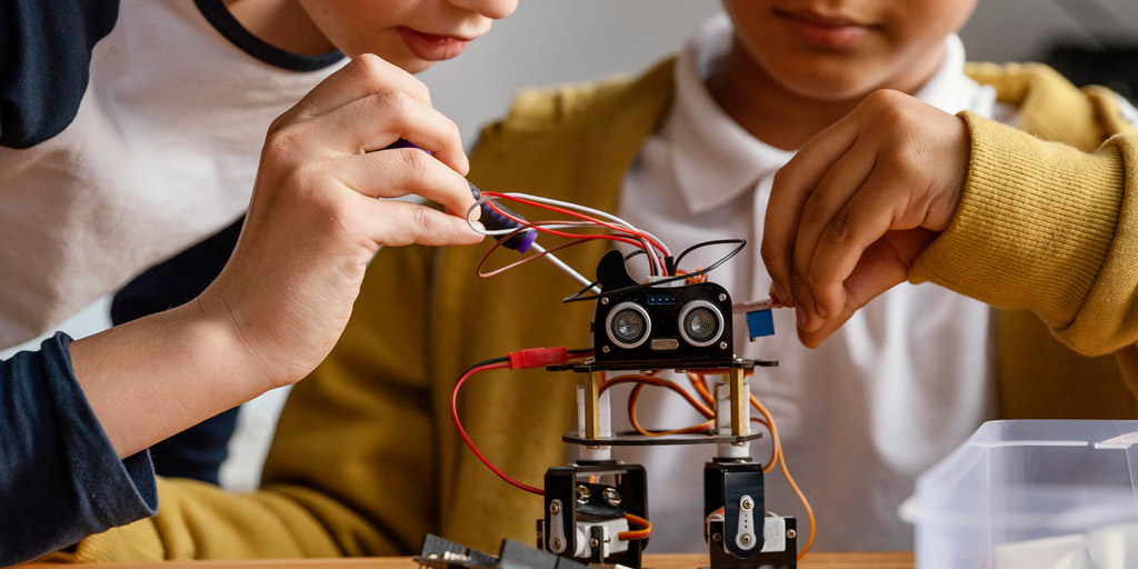 Children working with robotics