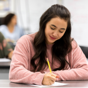 Girl taking a test with pencil