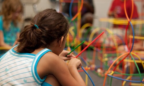 Young learner engaged in hands-on learning.